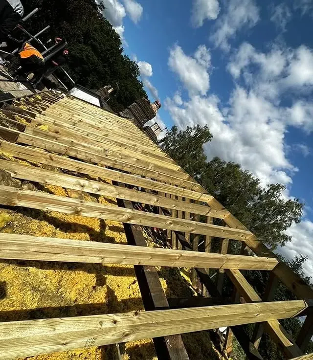Slate roof installation with chimney work