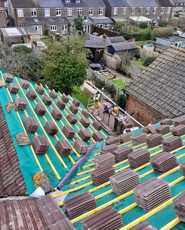 Dark slate roof replacement on a British brick house